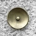 Green brass doorbell