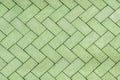 Green bricks tiled floor with zigzag pattern texture background Royalty Free Stock Photo