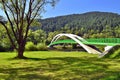 Green bridge for bikers and pedestrians over Dunajec river in Kroscienko, Poland. Royalty Free Stock Photo