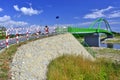 Green bridge  for bikers and pedestrians over Poprad river, Stary Sacz, Poland Royalty Free Stock Photo