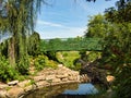 Green Bridge Crossing Beautiful Flower Garden Royalty Free Stock Photo