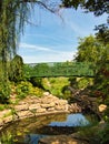 Green Bridge Crossing Beautiful Flower Garden Royalty Free Stock Photo