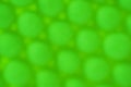 Green bright abstract blurred background. The surface of the circles, balls, cotton swabs, top view Royalty Free Stock Photo