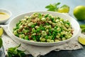 Green Broad beans and quinoa salad with sweet peas and mint. Healthy vegan food Royalty Free Stock Photo