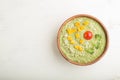 Green broccoli cream soup in wooden bowl on a white wooden background. top view, copy space Royalty Free Stock Photo