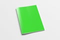 Green brochure or booklet cover mock up on white. Isolated with clipping path around brochure. Royalty Free Stock Photo