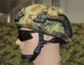 Green-brown camouflage military combat helmet with headset and g Royalty Free Stock Photo