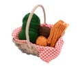 Green, brown and orange yarn with knitting in a basket Royalty Free Stock Photo