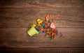 Green bucket, colorful wood shavings, pencil sharpeners pink and yellow on a wooden background. Text space. Back to school, art Royalty Free Stock Photo