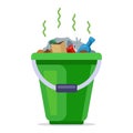 green bucket filled with rubbish. household household waste.