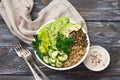 Green Buddha Bowl with lentils, quinoa, avocado, cucumber, fresh lettuce, herbs and seeds Royalty Free Stock Photo