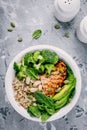 Green buddha bowl lunch with grilled chicken and quinoa, spinach, avocado, broccoli and white beans Royalty Free Stock Photo