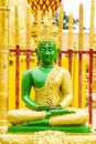 Green Buddha image on sitting position