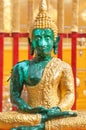 Green Buddha statue seated in the lotus position at Wat Phra That Doi Suthep, Chiang Mai, Thailand Royalty Free Stock Photo