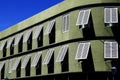 Green building with white windows Royalty Free Stock Photo