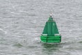 Green buoy as a marker for shipping