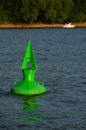 A green buoy marks the river Royalty Free Stock Photo