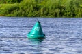 Green buoy on the river Royalty Free Stock Photo