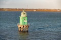 Green buoy tower lighthouse at Dublin harbour Royalty Free Stock Photo