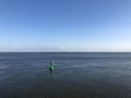 Green buoy at the wadden sea around Borkum