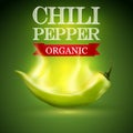 Green burning chili pepper on a green background Royalty Free Stock Photo