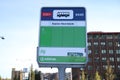 Green bus stop sign of Arriva on the north side of Gouda railway station.