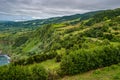 Green bushes at Tio Domingos viewpoint for panorama cliffs with typical landscape fields and mountain of SÃÂ£o Miguel Island, Azore