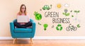 Green Business with young woman using her laptop Royalty Free Stock Photo