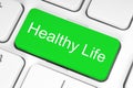 Green button with Healthy Life words on the keyboard, healthy concept Royalty Free Stock Photo