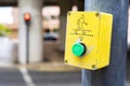 green button to activate light signal to give way to pedestrians Royalty Free Stock Photo