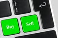 Green buttons with Buy and Sell words on the laptop keyboard. Online banking or E-business concept. Royalty Free Stock Photo