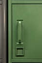 Green cabinet next to gray metal storage system. Color block. Royalty Free Stock Photo