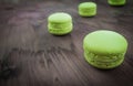 Green cake macaron on wood background, maccarone sweet dessert