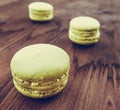 Green cake macaron on wood background, maccarone sweet dessert