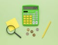 Green calculator, notebook, magnifying glass and coins on a green background