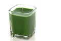 Green candle on white with clipping path