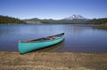 Green canoe on a lake shore Royalty Free Stock Photo