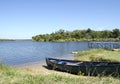 Green Canoe On The Lake Shore Royalty Free Stock Photo