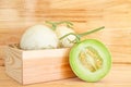 Green cantaloupe melon in wood box Royalty Free Stock Photo
