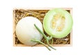 Green cantaloupe melon in wood box