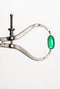 Green Capsule in Caliper. Isolated Royalty Free Stock Photo