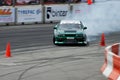 Green car drifting during Formula Drift Singapore