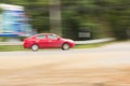 Red car panning speed on road, Thailand Asia