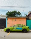 A green car parked in Tulum, Quintana Roo, Mexico