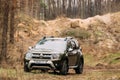 Green Car Renault Duster Or Dacia Duster Suv Parked In Forest