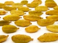 Green cardamom macro closeup on white background, horizontal, texture of cardamom seeds Royalty Free Stock Photo