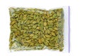 Green cardamon seeds in plastic packet isolated on the white Royalty Free Stock Photo