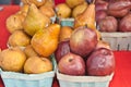 Green, cardboard containers filled with freshly picked, local, ripe pears and pomegranate Royalty Free Stock Photo