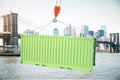 Green cargo container on hook