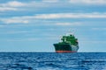 Green cargo ship moored